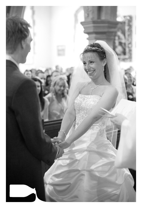 blushing bride on wedding day in church